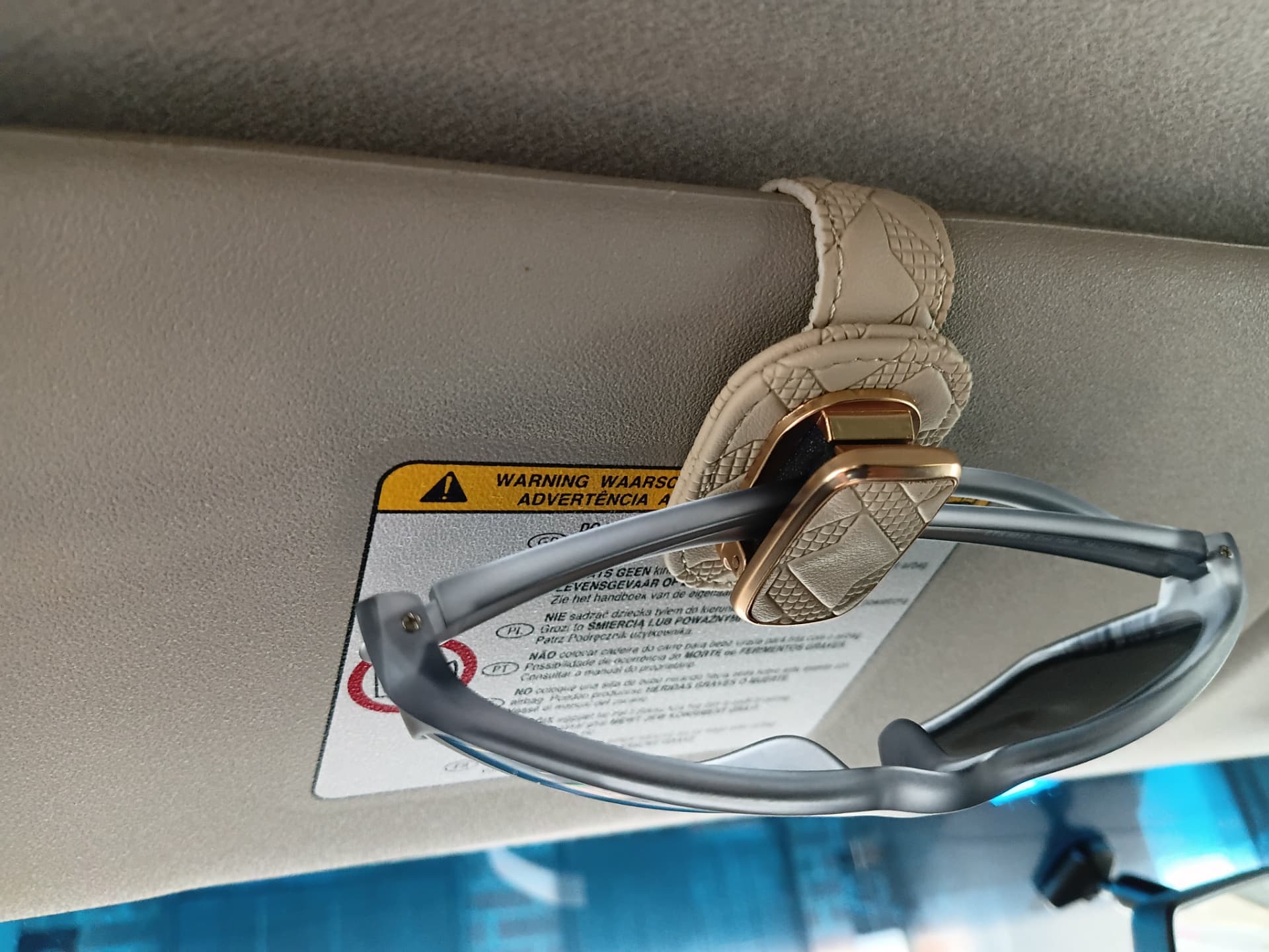 Visorlix sunglasses holder in a car interior